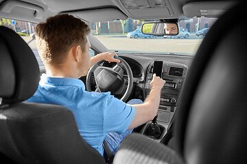 Image showing man or driver driving car and using gps navigator