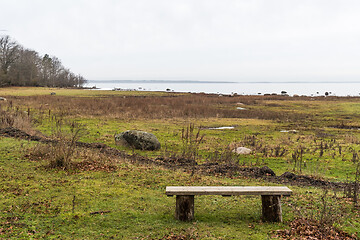 Image showing Coastal resting place with a bench