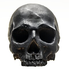 Image showing Spooky dark black skull aginast white background isolated