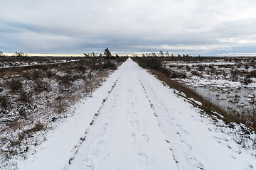 Image showing Trail across a barren landscape 