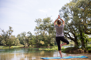 Image showing woman meditating and doing yoga exercise