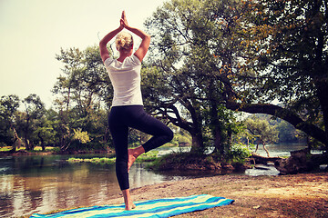 Image showing woman meditating and doing yoga exercise