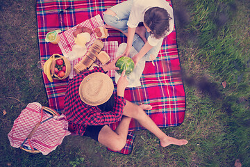 Image showing top view of couple enjoying picnic time