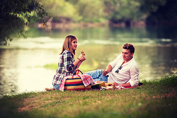 Image showing Couple in love enjoying picnic time