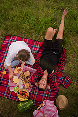 Image showing top view of couple enjoying picnic time