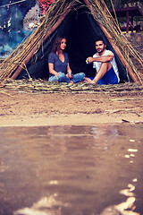 Image showing couple spending time together in straw tent