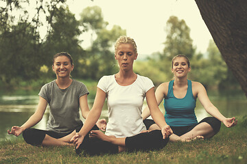 Image showing women meditating and doing yoga exercise