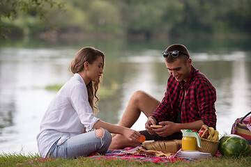 Image showing Couple in love enjoying picnic time