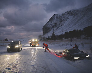 Image showing Car being towed after accident in snow storm