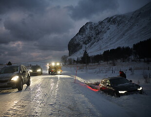 Image showing Car being towed after accident in snow storm