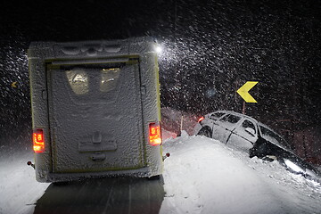 Image showing car accident on slippery winter road at night