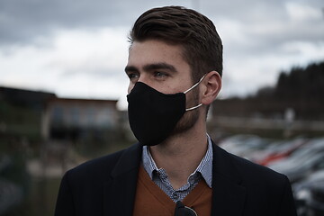 Image showing business man wearing protective face mask at luxury office