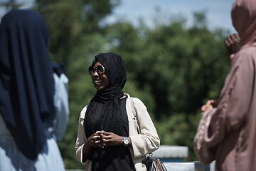 Image showing woman giving presentation to group of business investors on local honey production farm