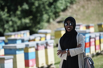 Image showing african muslim businesswoman portrait on small local honey production farm