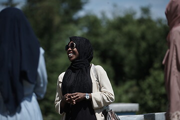 Image showing woman giving presentation to group of business investors on local honey production farm