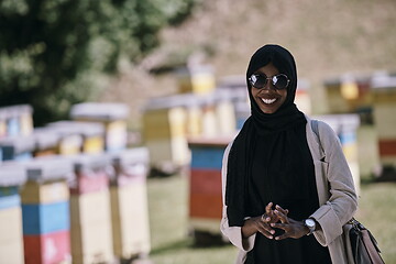 Image showing african muslim businesswoman portrait on small local honey production farm