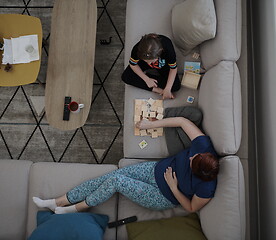 Image showing mother and daughter at home playing memory game