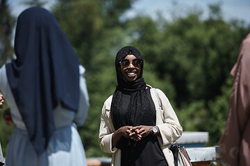 Image showing woman giving presentation to group of business investors on local honey production farm