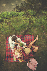 Image showing top view of couple enjoying picnic time