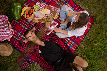 Image showing top view of couple enjoying picnic time