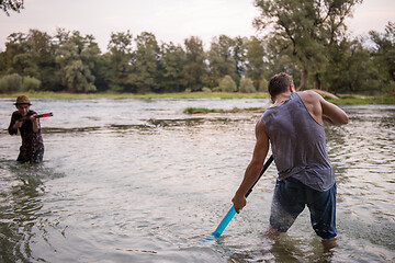 Image showing young men having fun with water guns