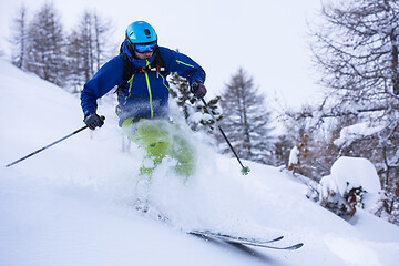 Image showing freeride skier skiing downhill