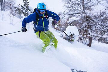 Image showing freeride skier skiing downhill