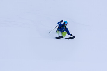 Image showing freeride skier skiing downhill