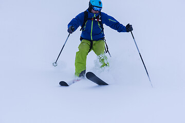 Image showing freeride skier skiing downhill