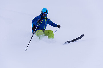 Image showing freeride skier skiing downhill