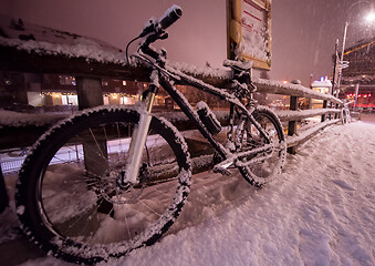 Image showing parked bicycle covered by snow