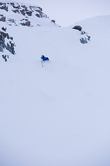 Image showing freeride skier skiing downhill