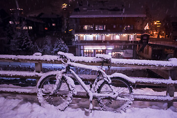 Image showing parked bicycle covered by snow