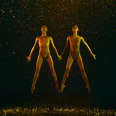 Image showing Two young female ballet dancers under water drops