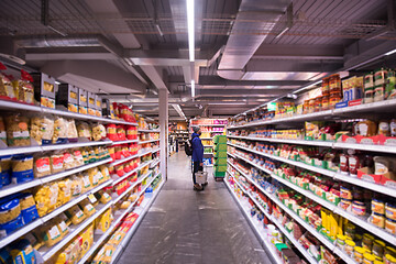 Image showing Man shopping in modern supermarket