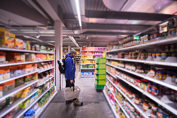 Image showing Man shopping in modern supermarket