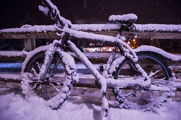 Image showing parked bicycle covered by snow