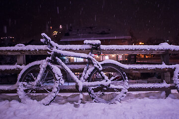 Image showing parked bicycle covered by snow