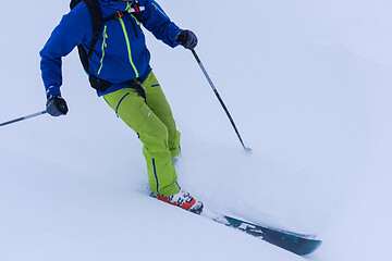 Image showing freeride skier skiing downhill