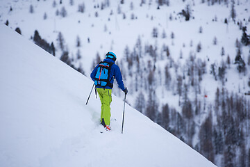 Image showing freeride skier skiing downhill