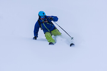 Image showing freeride skier skiing downhill