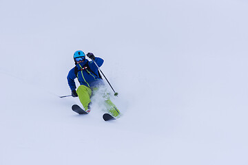 Image showing freeride skier skiing downhill