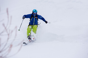 Image showing freeride skier skiing downhill