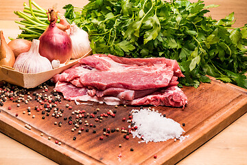 Image showing Raw pork ribs in the loin on a wooden board