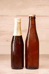 Image showing a bottle of blond beer and a bottle of amber beer