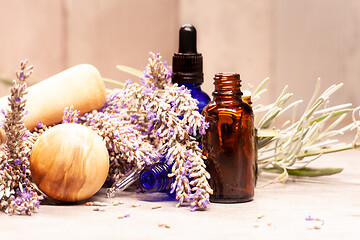 Image showing lavender mortar and pestle and bottles of essential oils for aro