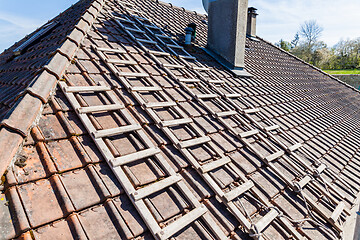 Image showing renovation of a brick tiled roof