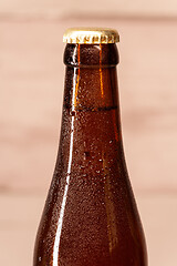 Image showing a bottle of amber beer with its capsule