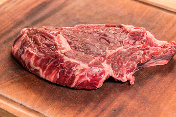 Image showing steak of beef on a wooden board