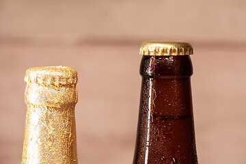 Image showing a bottle of blond beer and a bottle of amber beer